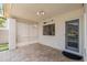 Cozy covered patio with lattice, tiled flooring, and easy access to the backyard at 5510 W Arrowhead Lakes Dr, Glendale, AZ 85308