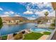 Beautiful backyard oasis with pool overlooking a lake and mountain views on a sunny day at 5510 W Arrowhead Lakes Dr, Glendale, AZ 85308