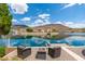 Relaxing waterfront setting with comfortable seating and stunning views of the tranquil lake at 5510 W Arrowhead Lakes Dr, Glendale, AZ 85308