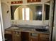 Bathroom with a double vanity, mirrors and light fixtures at 5716 E Desert Vista Trl, Cave Creek, AZ 85331