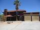 A two-story house showcases a red tile roof, desert landscaping, and an inviting entrance at 5716 E Desert Vista Trl, Cave Creek, AZ 85331