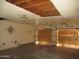 Garage needing repair work features open ceiling and boarded-up garage doors at 5716 E Desert Vista Trl, Cave Creek, AZ 85331