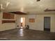 Garage needing repair, walls with holes, and a door leading to the house at 5716 E Desert Vista Trl, Cave Creek, AZ 85331
