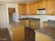 Kitchen area showcases wood cabinetry, tile flooring, and plenty of countertop space at 5716 E Desert Vista Trl, Cave Creek, AZ 85331