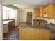 Kitchen featuring tile flooring, wood cabinets, and ample countertop space at 5716 E Desert Vista Trl, Cave Creek, AZ 85331