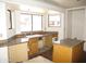 Kitchen featuring a bay window, ample countertop space, tile flooring, and wood cabinets at 5716 E Desert Vista Trl, Cave Creek, AZ 85331