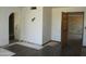A living room featuring arched doorways and an open entryway at 5716 E Desert Vista Trl, Cave Creek, AZ 85331