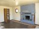 A living room featuring a fireplace, window, and an open doorway to another room at 5716 E Desert Vista Trl, Cave Creek, AZ 85331