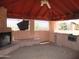 This is a covered outdoor pavilion with a fireplace and built-in bench seating at 5716 E Desert Vista Trl, Cave Creek, AZ 85331