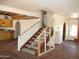 Staircase in home with terracotta tile and partial framing for renovation at 5716 E Desert Vista Trl, Cave Creek, AZ 85331