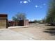 Exterior view of the yard and various out buildings, as well as a glimpse of the main house at 5716 E Desert Vista Trl, Cave Creek, AZ 85331