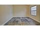 Bedroom with neutral walls, large format floor tiling and a big window with a dark frame at 602 N May -- # 17, Mesa, AZ 85201