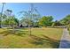 Residential building exterior with lush green landscaping and mature trees at 602 N May -- # 17, Mesa, AZ 85201