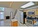 Bright kitchen boasts stainless steel appliances, an island, and a stylish tile floor at 602 N May -- # 17, Mesa, AZ 85201