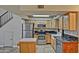 Well-lit kitchen with stainless steel appliances, granite countertops, and wooden cabinetry at 602 N May -- # 17, Mesa, AZ 85201