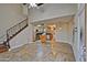 Open-concept living area with tile floors, a staircase, and a view into the kitchen at 602 N May -- # 17, Mesa, AZ 85201
