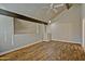 Vaulted ceiling and wood beams highlight this living room with hardwood floors at 602 N May -- # 17, Mesa, AZ 85201