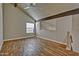 Living room featuring exposed wood beams, vaulted ceilings and beautiful hardwood floors at 602 N May -- # 17, Mesa, AZ 85201