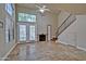 Spacious living room showcasing high ceilings, fireplace, tile flooring, and abundant natural light at 602 N May -- # 17, Mesa, AZ 85201