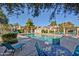 Community pool with plenty of lounge seating and well-maintained landscaping at 602 N May -- # 17, Mesa, AZ 85201