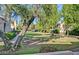Expansive green lawn surrounded by trees, offering a serene outdoor space at 602 N May -- # 17, Mesa, AZ 85201