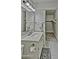 Small bathroom with a gray tile floor and a white vanity and a view into a storage space at 602 N May -- # 23, Mesa, AZ 85201