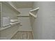 Walk in closet with carpet, shelving, pillows, and a laundry basket at 602 N May -- # 23, Mesa, AZ 85201