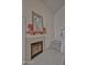 Elegant fireplace with decorative tile, a mantle, and a mirror above at 602 N May -- # 23, Mesa, AZ 85201