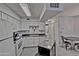 Modern kitchen with white cabinetry, appliances, and a central island at 602 N May -- # 23, Mesa, AZ 85201
