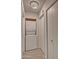 Neat laundry area with stacked washer and dryer, plus extra storage space at 602 N May -- # 23, Mesa, AZ 85201