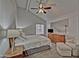 Tranquil main bedroom with a high ceiling, fan, and seating area at 602 N May -- # 23, Mesa, AZ 85201