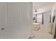 View of the bedroom through the door featuring a ceiling fan and a large window at 6931 W Spur Dr, Peoria, AZ 85383