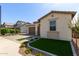 Charming single-story home featuring a well-manicured lawn, tile roof, and attached two-car garage at 6931 W Spur Dr, Peoria, AZ 85383