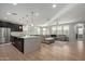 Spacious open-concept living space features a gourmet kitchen and a comfortable living room at 6931 W Spur Dr, Peoria, AZ 85383