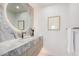 Modern bathroom featuring an elegant mirror and a marble-topped vanity at 7137 E Rancho Vista Dr # 4011, Scottsdale, AZ 85251