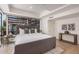 Stylish bedroom boasts a large window, modern furniture, and ample light at 7137 E Rancho Vista Dr # 4011, Scottsdale, AZ 85251