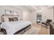 Modern bedroom featuring a large bed, wood floors, and minimalist decor at 7137 E Rancho Vista Dr # 4011, Scottsdale, AZ 85251