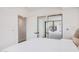 Well-lit bedroom includes mirrored closet doors and an en-suite bathroom at 7137 E Rancho Vista Dr # 4011, Scottsdale, AZ 85251