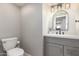 Clean bathroom showcasing a vanity with a marble countertop and chrome fixtures at 736 S Winthrop Cir, Mesa, AZ 85204