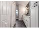 Contemporary bathroom boasting a sleek vanity, round mirror, and modern lighting fixtures at 736 S Winthrop Cir, Mesa, AZ 85204