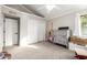 Bright bedroom with neutral carpet, white trim, and vaulted ceilings at 736 S Winthrop Cir, Mesa, AZ 85204