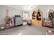 Cozy bedroom with vaulted ceilings, large windows, and colorful decor at 736 S Winthrop Cir, Mesa, AZ 85204