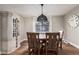 Traditional dining room featuring hardwood floors, ornate lighting, and matching furnishings at 736 S Winthrop Cir, Mesa, AZ 85204