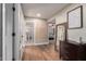 Inviting hallway showcasing hardwood floors, decor, and bathroom and bedroom access at 736 S Winthrop Cir, Mesa, AZ 85204
