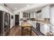 Modern kitchen featuring white cabinetry, stainless steel appliances and hardwood flooring at 736 S Winthrop Cir, Mesa, AZ 85204