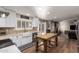 Open kitchen showcasing white cabinetry, farmhouse sink, an island, and stainless steel appliances at 736 S Winthrop Cir, Mesa, AZ 85204