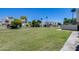 Well-maintained common green area surrounded by lush landscaping and charming homes at 7808 E Valley Vista Dr, Scottsdale, AZ 85250