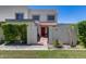 Charming two-story home with a red tile entry, desert landscaping, and an enclosed front yard at 7808 E Valley Vista Dr, Scottsdale, AZ 85250