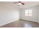 Bright bedroom with tile flooring and a window, providing a serene and comfortable living space at 8021 W Hazelwood St, Phoenix, AZ 85033