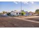 Corner lot home with desert landscaping and low maintenance yard with mature shade trees at 8021 W Hazelwood St, Phoenix, AZ 85033